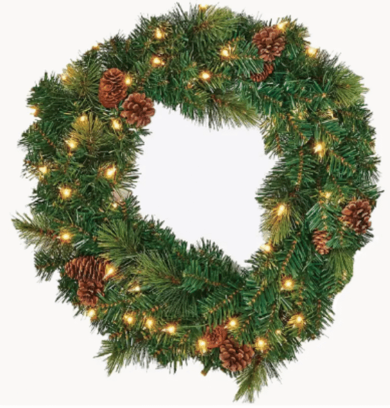 Green Christmas wreath with pinecones and warm lights for holiday decoration.
