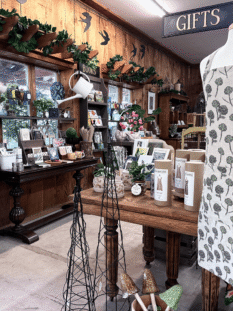 Vintage gift shop interior with garden-themed home decor and accessories at Herbein's Garden Center.