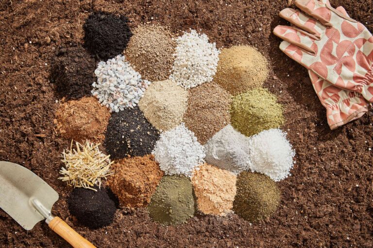 Colorful garden soil amendments and fertilizers for healthy plant growth at Herbein's Garden Center.