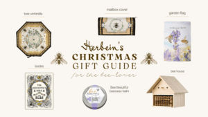 Decorative bees and flower mailbox cover for garden decor.