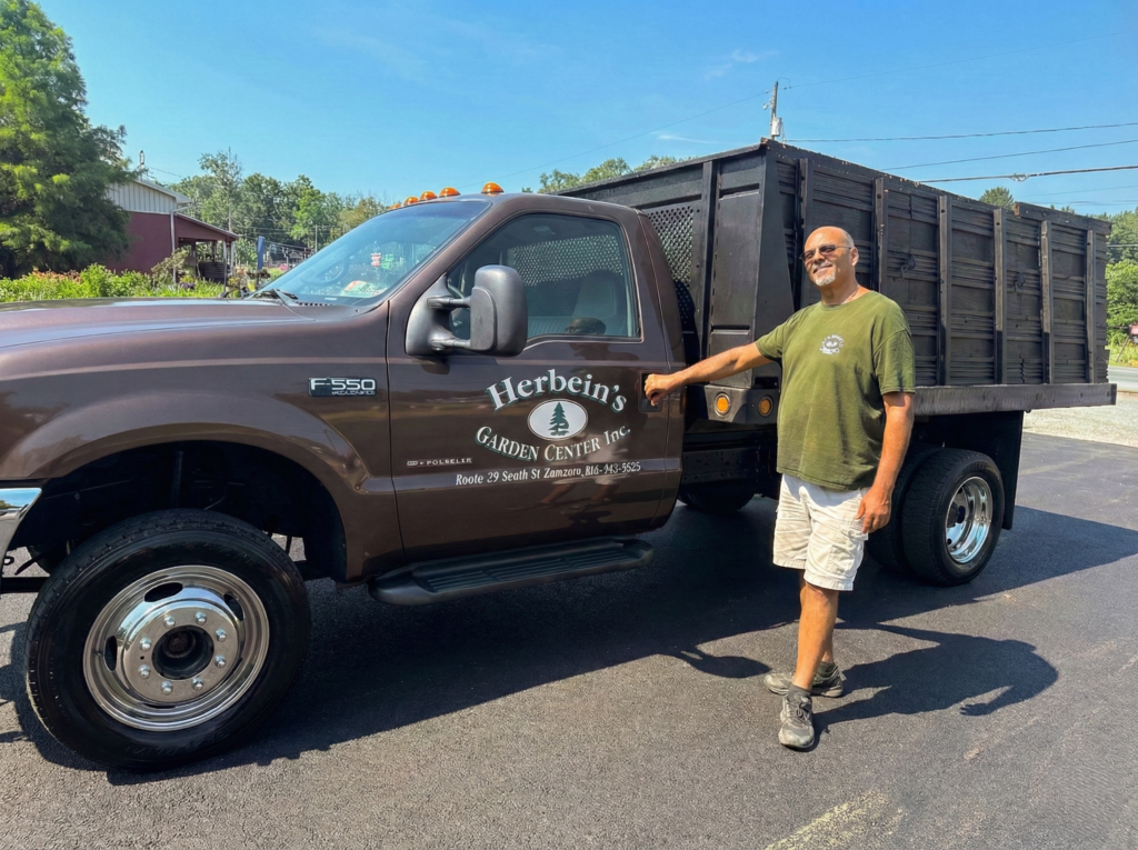 Herbein's Garden Center Inc. truck with landscaping services, local garden supply delivery vehicle.