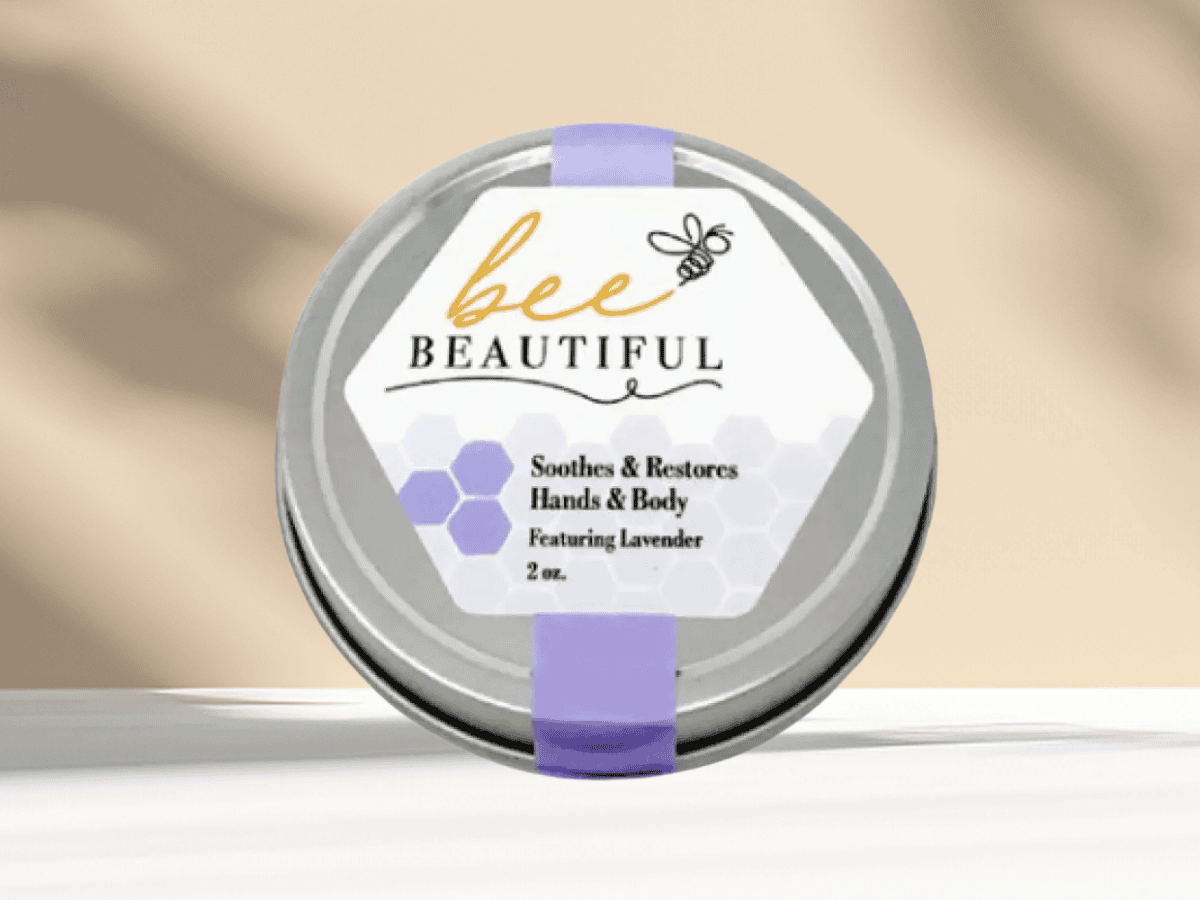 Image of Bee Beautiful lavender hand and body cream jar, promoting natural skincare products from Herbein's Garden Center.