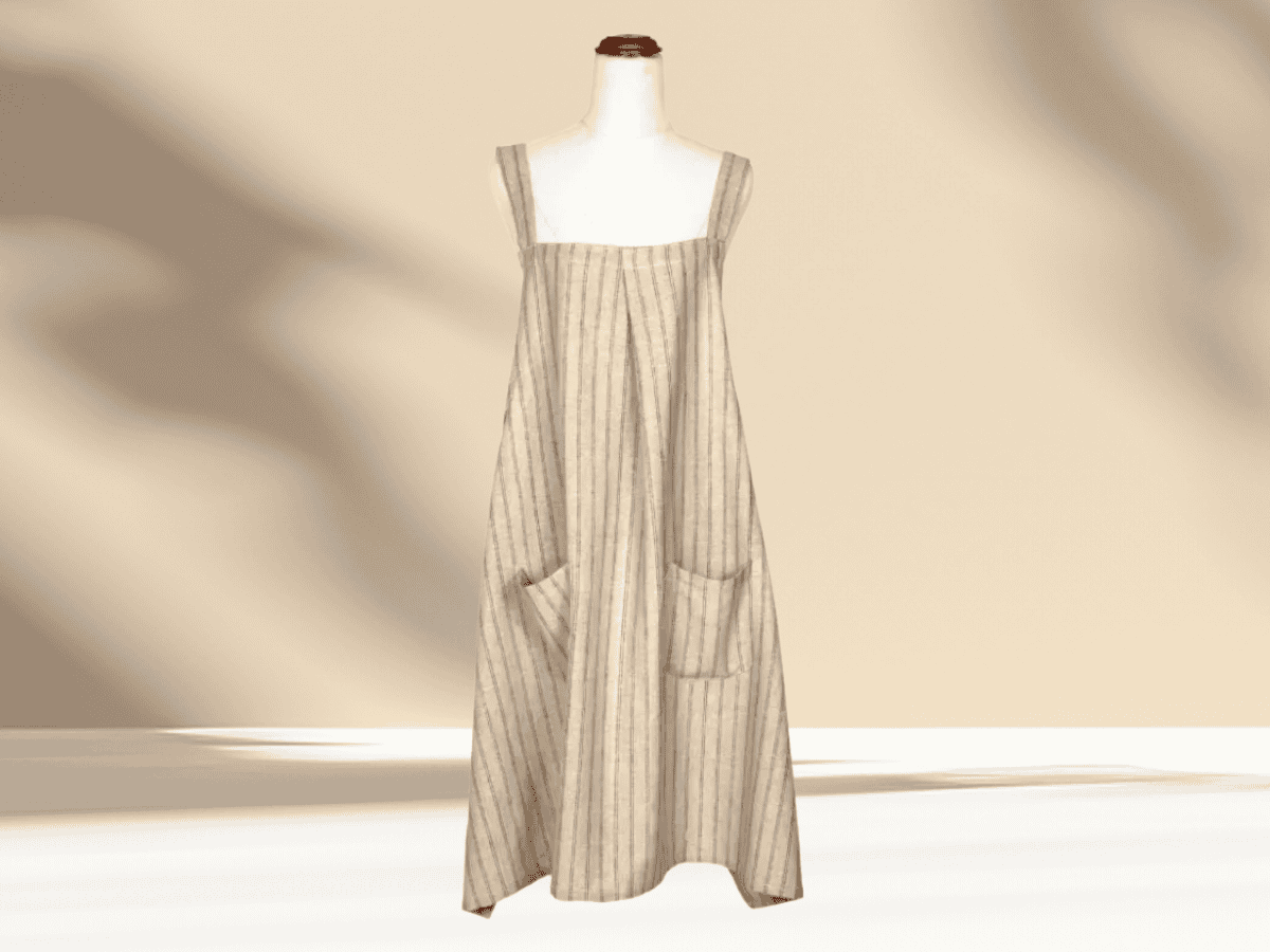 Versatile linen dress with pockets and adjustable straps, ideal for warm weather and casual outings.