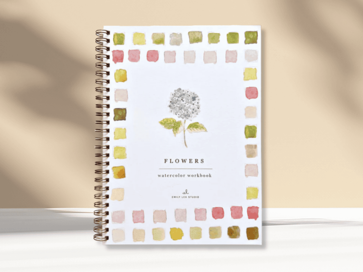 Watercolor flower workbook cover featuring a blue hydrangea illustration.
