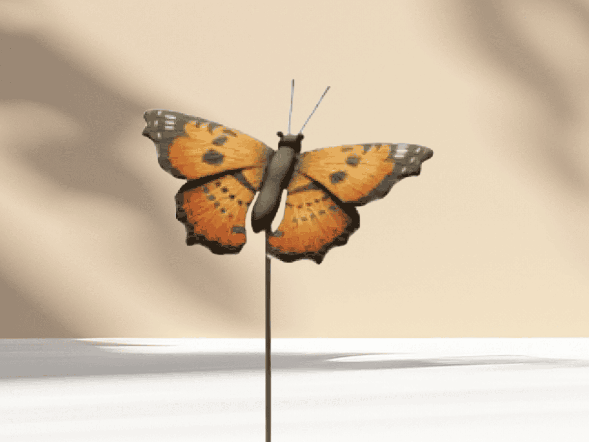 Vivid monarch butterfly sculpture enhances garden decor and butterfly-friendly landscaping.