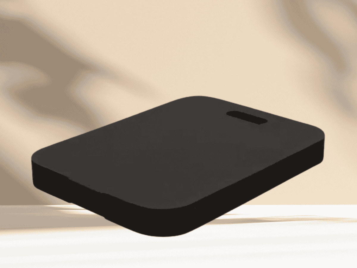 Image of a sleek black wireless charging pad mounted on a wall for convenient device charging.