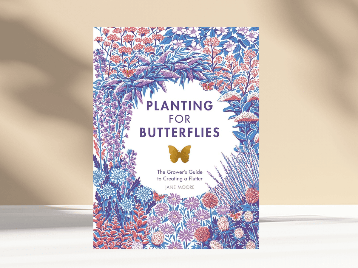 Decorative butterfly-themed gardening book cover with vibrant floral design.