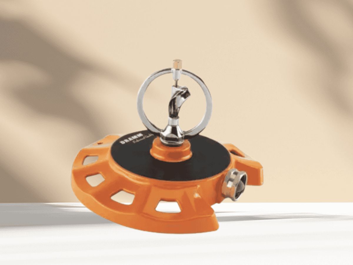 Metal garden irrigation sprinkler for outdoor watering. Durable plastic and adjustable spray for lawns and gardens.