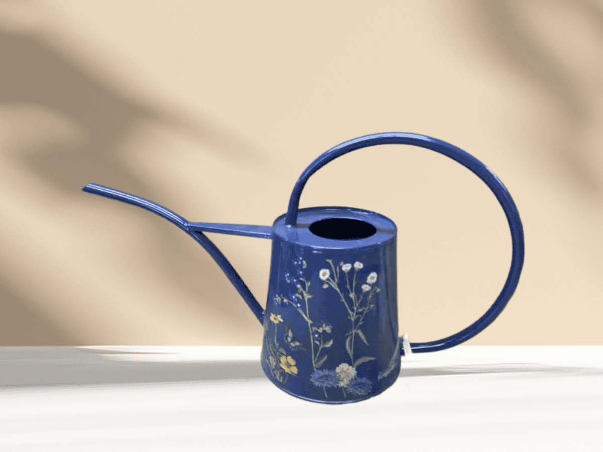 Colorful floral-patterned watering can for garden watering and plant maintenance.