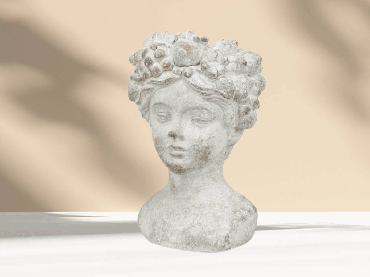Stone garden bust sculpture of a woman's face, perfect for enhancing your garden or patio decor.